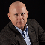 professional headshot bald male in suit