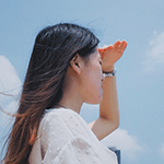 Asian woman searching the horizon